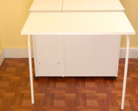 Sewing cabinets, tables, and sewing furniture by Arrow.