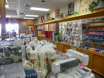 Temple Sew And Quilt Store fabric wall display pic